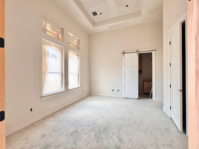 1162 Rd 6604, Dayton, TX 77535 - unfurnished bedroom with concrete flooring, a tray ceiling, and a high ceiling