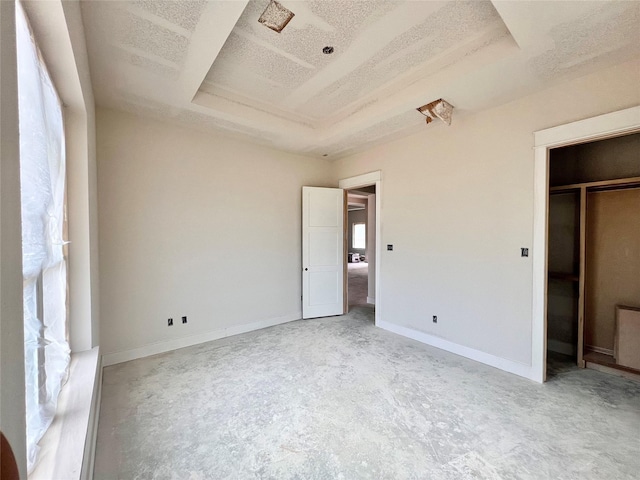 1162 Rd 6604, Dayton, TX 77535 - unfurnished bedroom featuring a raised ceiling and baseboards