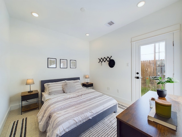 2704 Jensen Creek Ln, Houston, TX 77026 - bedroom featuring light carpet, recessed lighting, and access to exterior
