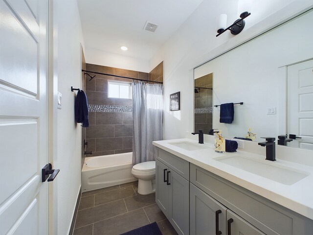 2704 Jensen Creek Ln, Houston, TX 77026 - full bathroom featuring tile patterned flooring, double vanity, and shower / bath combination with curtain
