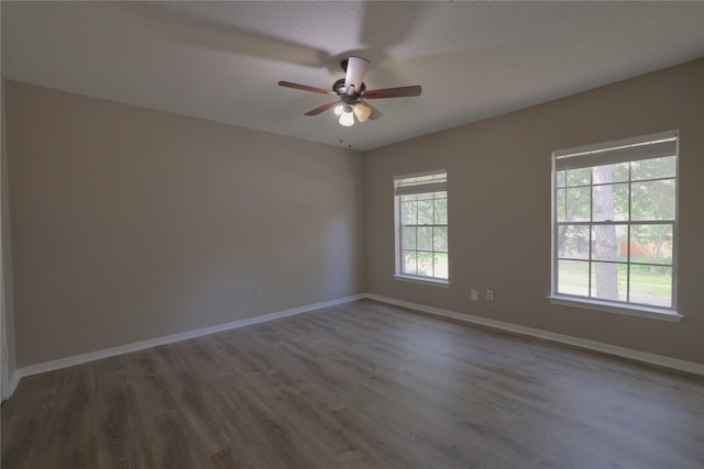 15918 Pinyon Creek Dr, Houston, TX 77095 - empty room featuring a ceiling fan and wood finished floors