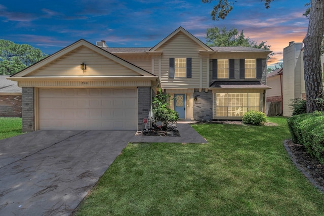 15918 Pinyon Creek Dr, Houston, TX 77095 - view of front facade featuring brick siding, concrete driveway, an attached garage, and a front lawn