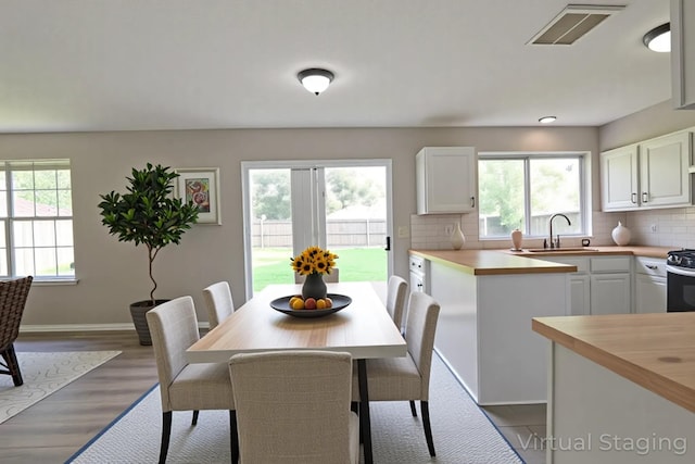 15918 Pinyon Creek Dr, Houston, TX 77095 - dining area with wood finished floors and baseboards