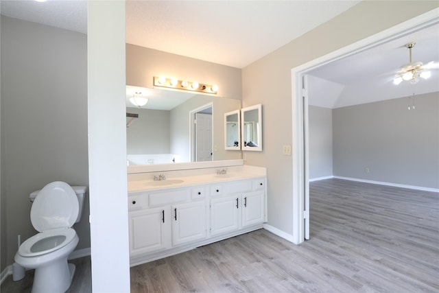 15918 Pinyon Creek Dr, Houston, TX 77095 - full bath with double vanity, wood finished floors, and a ceiling fan