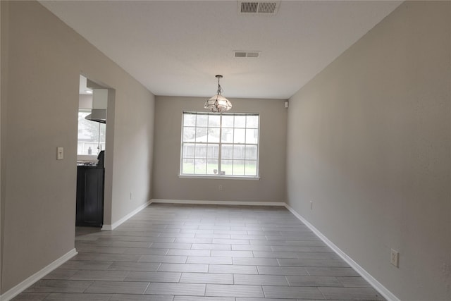 15918 Pinyon Creek Dr, Houston, TX 77095 - unfurnished room with a chandelier and wood finished floors