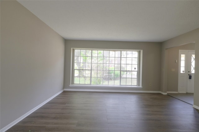 15918 Pinyon Creek Dr, Houston, TX 77095 - entryway featuring dark wood-type flooring and baseboards