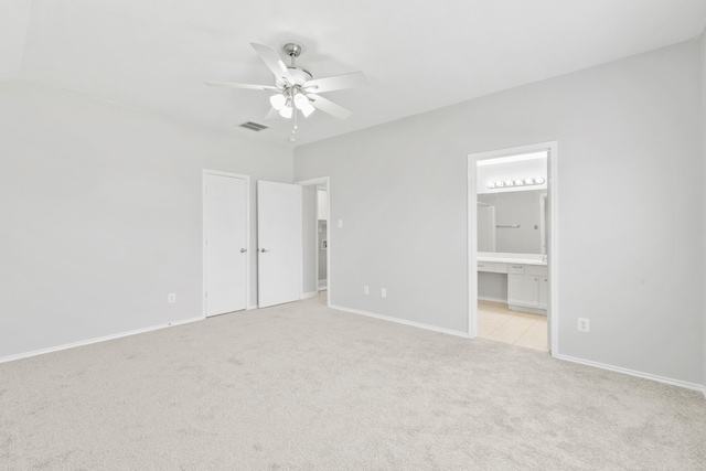 1611 Hade Meadow Ln, Houston, TX 77073 - unfurnished bedroom featuring light colored carpet, ensuite bathroom, and a ceiling fan