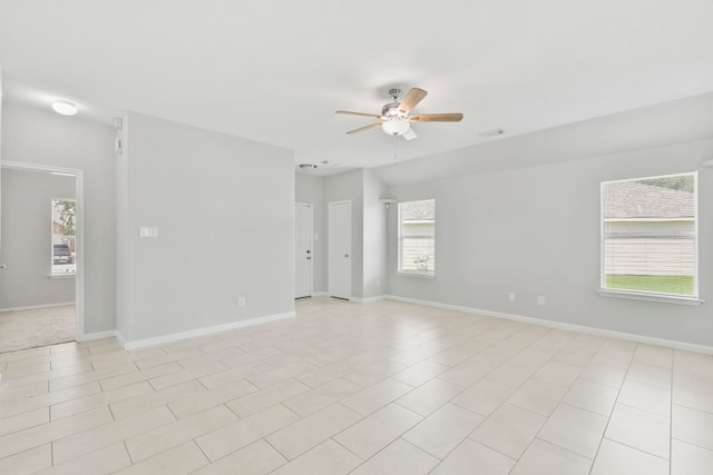1611 Hade Meadow Ln, Houston, TX 77073 - empty room featuring ceiling fan, healthy amount of natural light, and light tile patterned floors