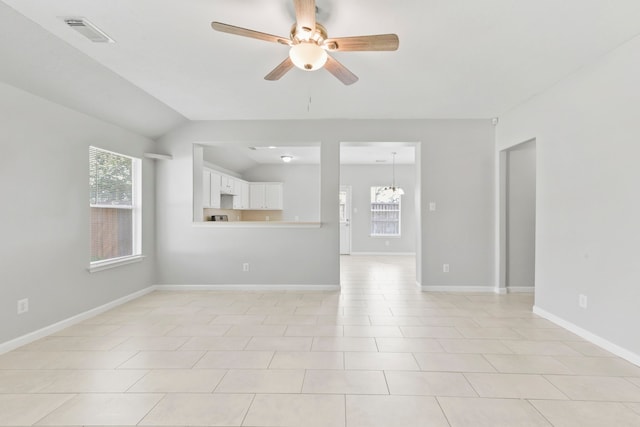1611 Hade Meadow Ln, Houston, TX 77073 - unfurnished living room with ceiling fan, a chandelier, lofted ceiling, and light tile patterned floors