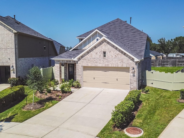 10663 Whitejacket, Conroe, TX 77385 - view of front of house with brick siding, concrete driveway, roof with shingles, and an attached garage