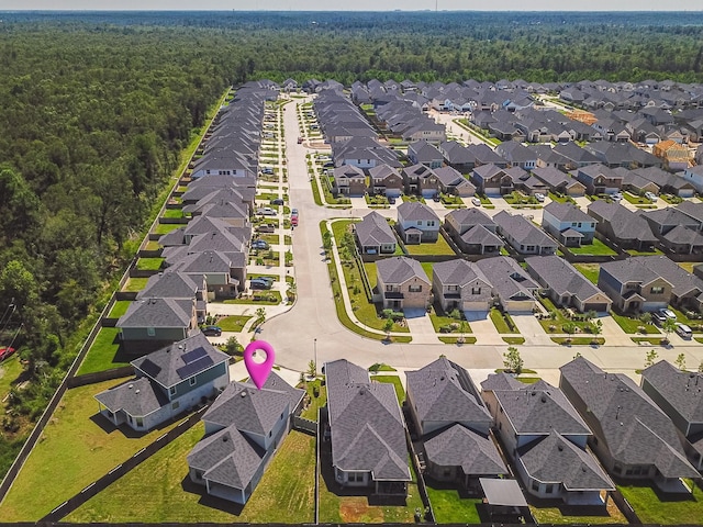 10663 Whitejacket, Conroe, TX 77385 - aerial view of residential area featuring a heavily wooded area