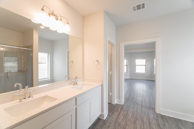 10663 Whitejacket, Conroe, TX 77385 - full bath with double vanity, wood finished floors, and a stall shower
