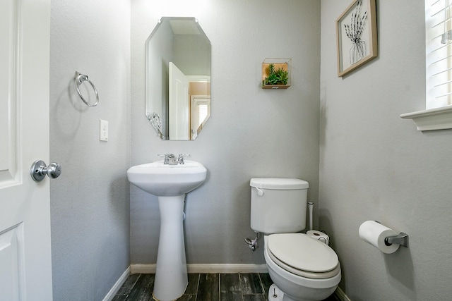 10219 Kentington Oak Dr, Humble, TX 77396 - half bathroom featuring wood finished floors and toilet