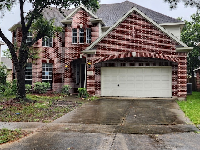 9510 Gentry Shadows Ln, Humble, TX 77396 - traditional home with brick siding, driveway, roof with shingles, and a garage