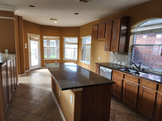 9510 Gentry Shadows Ln, Humble, TX 77396 - kitchen with dishwasher, tasteful backsplash, a kitchen island, dark stone counters, and tile patterned flooring