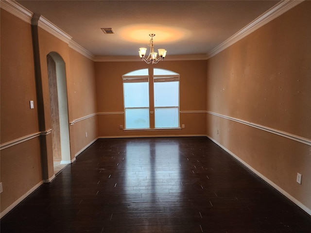 9510 Gentry Shadows Ln, Humble, TX 77396 - empty room featuring arched walkways, hardwood / wood-style floors, a chandelier, and ornamental molding