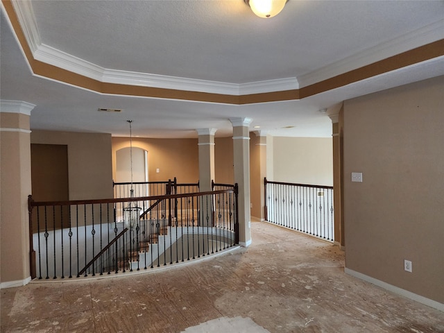 9510 Gentry Shadows Ln, Humble, TX 77396 - unfurnished room with ornamental molding, a tray ceiling, and decorative columns