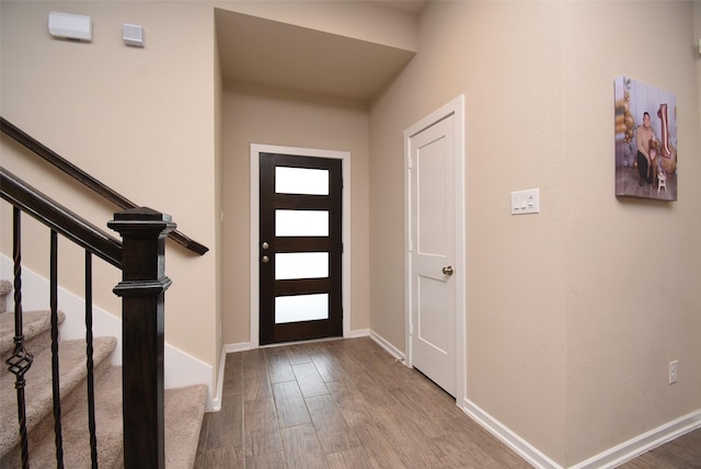 7011 Golden Groundsel Dr, Katy, TX 77493 - entryway featuring wood finished floors and stairs