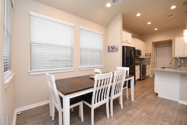 7011 Golden Groundsel Dr, Katy, TX 77493 - dining room featuring light wood-style floors and recessed lighting