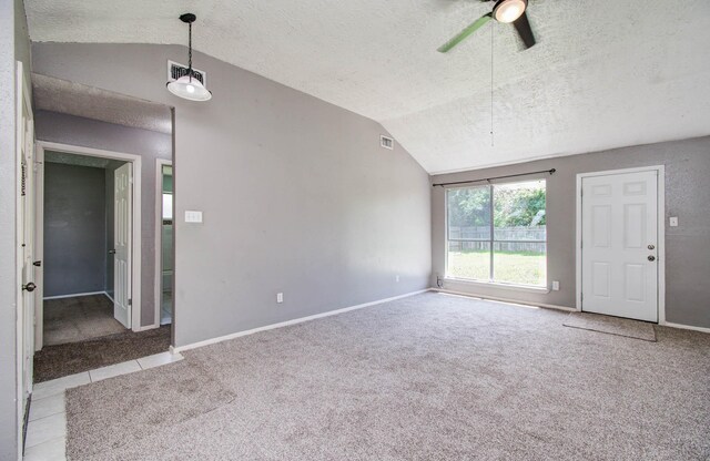 906 Dixie Dr, League City, TX 77573 - spare room featuring lofted ceiling, a textured ceiling, carpet flooring, and a ceiling fan
