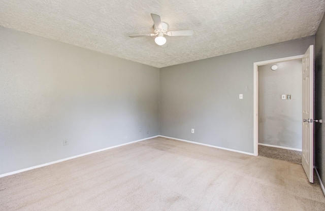 906 Dixie Dr, League City, TX 77573 - unfurnished room featuring ceiling fan, light colored carpet, and a textured ceiling