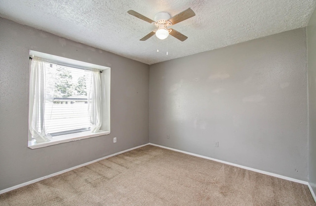 906 Dixie Dr, League City, TX 77573 - empty room featuring a ceiling fan, light carpet, and a textured ceiling