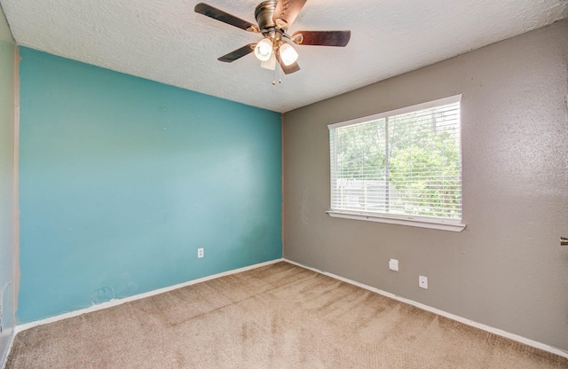906 Dixie Dr, League City, TX 77573 - unfurnished room with carpet floors, a ceiling fan, and a textured ceiling