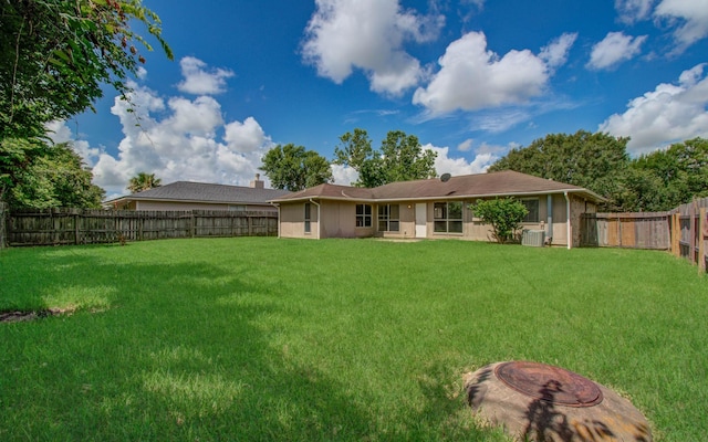 906 Dixie Dr, League City, TX 77573 - rear view of house with a fenced backyard