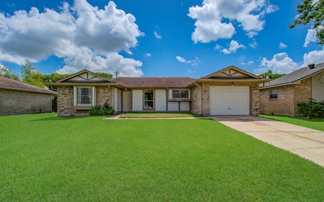 906 Dixie Dr, League City, TX 77573 - single story home with brick siding, concrete driveway, a garage, and a front yard
