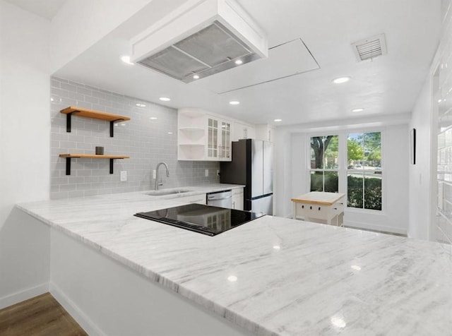 850 Threadneedle St Unit 78, Houston, TX 77079 - kitchen with open shelves, stainless steel appliances, premium range hood, a peninsula, and dark wood-style flooring