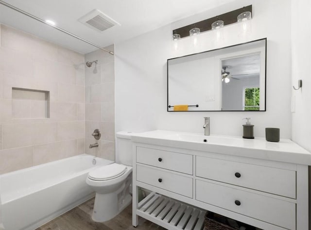850 Threadneedle St Unit 78, Houston, TX 77079 - bathroom with vanity, shower / washtub combination, wood finished floors, and ceiling fan