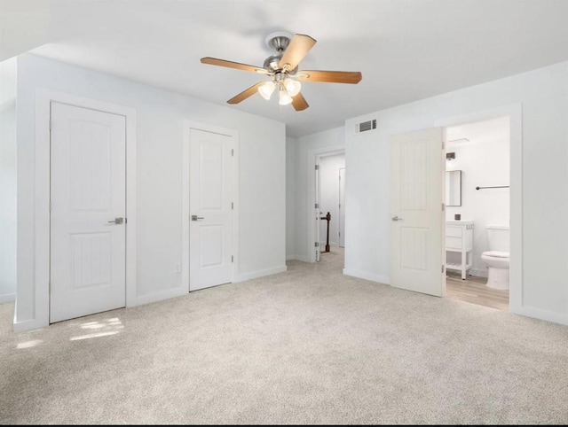 850 Threadneedle St Unit 78, Houston, TX 77079 - unfurnished bedroom with carpet floors, connected bathroom, and a ceiling fan