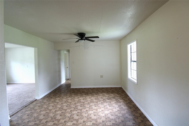 6615 Live Oak Dr, Freeport, TX 77541 - spare room featuring ceiling fan and baseboards