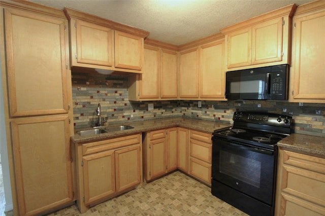 6615 Live Oak Dr, Freeport, TX 77541 - kitchen with black appliances, light brown cabinetry, backsplash, light floors, and dark stone countertops