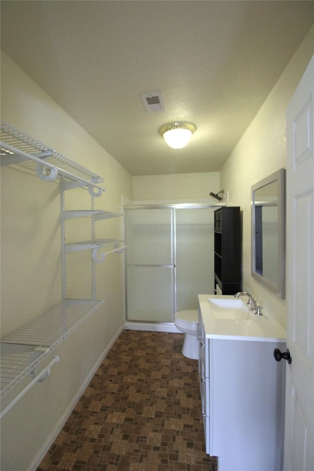6615 Live Oak Dr, Freeport, TX 77541 - bathroom featuring vanity and a shower with shower door