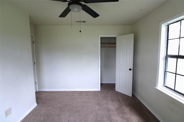 6615 Live Oak Dr, Freeport, TX 77541 - unfurnished bedroom featuring carpet flooring, multiple windows, and a closet