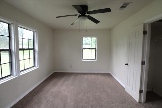 6615 Live Oak Dr, Freeport, TX 77541 - unfurnished bedroom featuring carpet flooring and a ceiling fan