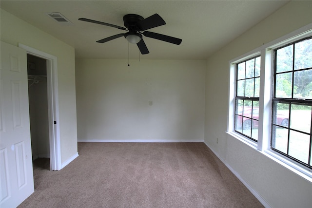6615 Live Oak Dr, Freeport, TX 77541 - unfurnished bedroom featuring light carpet, a closet, and ceiling fan
