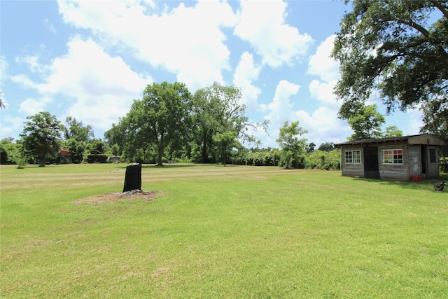 6615 Live Oak Dr, Freeport, TX 77541 - view of grassy yard featuring an outbuilding