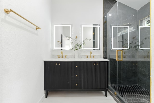 1311 E 35th St, Houston, TX 77022 - bathroom featuring double vanity and a marble finish shower