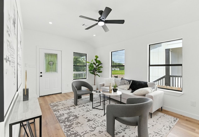 1311 E 35th St, Houston, TX 77022 - living room featuring vaulted ceiling, light wood-type flooring, and ceiling fan