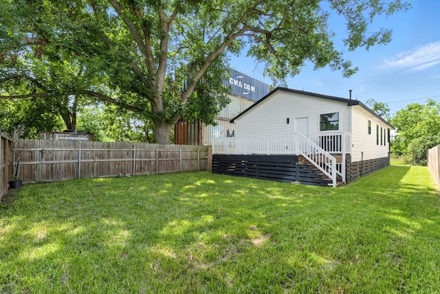 1311 E 35th St, Houston, TX 77022 - rear view of house with a fenced backyard and a deck