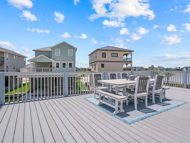 441 Jeanie Lynne Cir, Galveston, TX 77554 - wooden deck with outdoor dining area