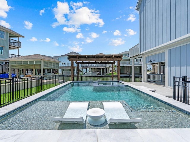 441 Jeanie Lynne Cir, Galveston, TX 77554 - view of swimming pool with a pool with connected hot tub, a pergola, and a patio area