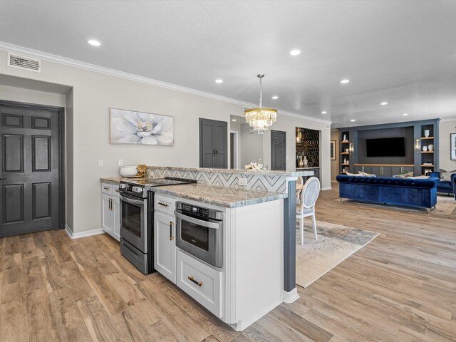 441 Jeanie Lynne Cir, Galveston, TX 77554 - kitchen featuring stainless steel range with electric stovetop, a chandelier, a kitchen breakfast bar, ornamental molding, and light wood-style floors