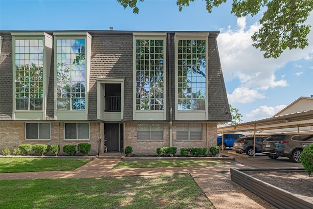 12633 Memorial Dr Unit 250, Houston, TX 77024 - view of building exterior with covered parking