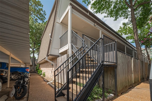 12633 Memorial Dr Unit 250, Houston, TX 77024 - view of side of home with stairway and brick siding
