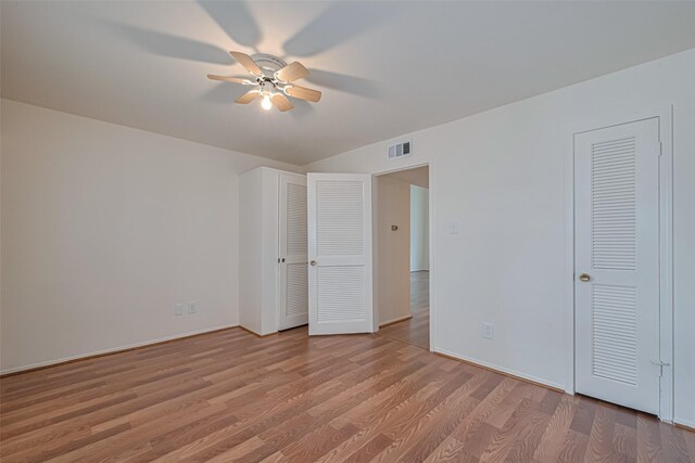 12633 Memorial Dr Unit 250, Houston, TX 77024 - unfurnished bedroom featuring light wood-style floors and a ceiling fan