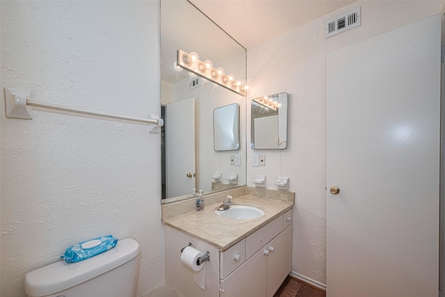 12633 Memorial Dr Unit 250, Houston, TX 77024 - half bathroom featuring toilet and vanity