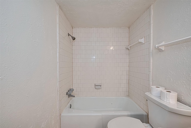 12633 Memorial Dr Unit 250, Houston, TX 77024 - bathroom with a textured wall, a textured ceiling, and shower / bath combination